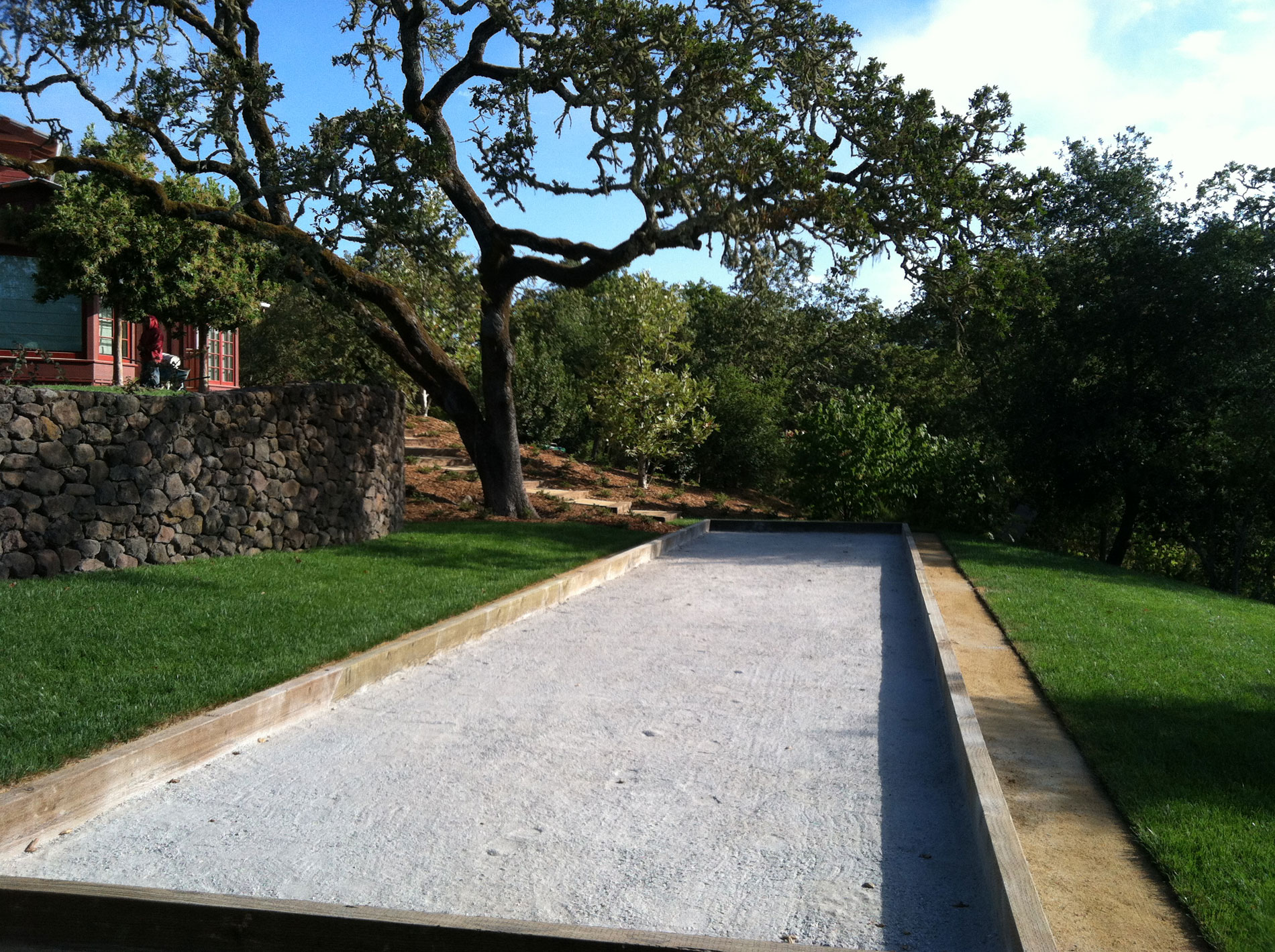 A bocce court was constructed on a terrace one level down from the pool terrace.